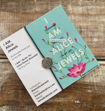 Jewelry card with 'I AM Alice Jewels' design on a wooden surface