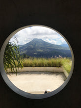 Mount Agung viewed through a circular window, Kintamani, Bali